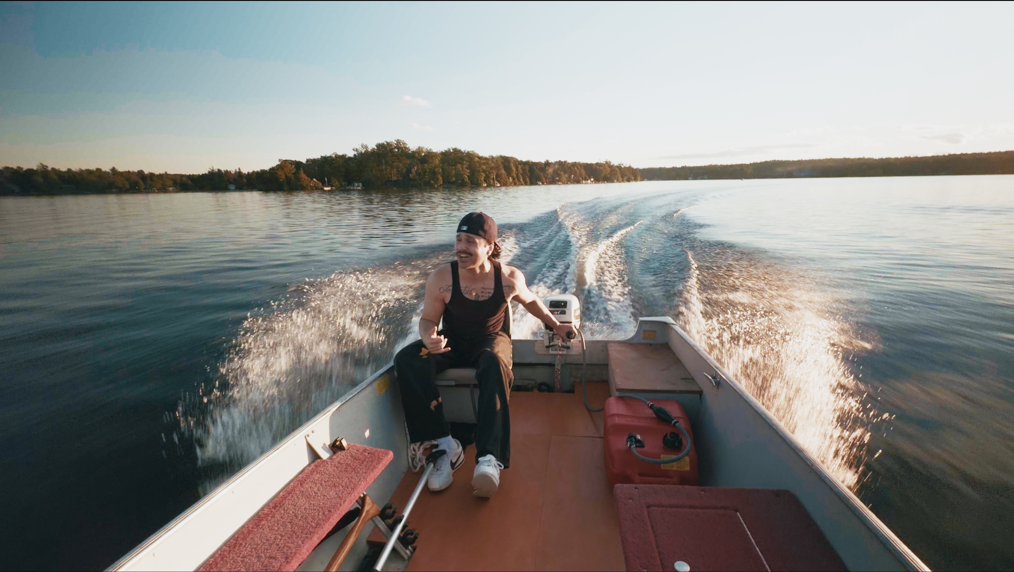 JOZY on a motorboat looking out with an open expression